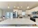 Bright kitchen with white cabinets, stainless steel appliances, and a large quartz island at 21341 Edgewater Dr, Port Charlotte, FL 33952