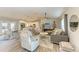 Open concept living room with hardwood floors and a cozy seating area at 21341 Edgewater Dr, Port Charlotte, FL 33952