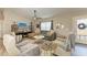 Spacious living room with hardwood floors, fireplace and large windows at 21341 Edgewater Dr, Port Charlotte, FL 33952