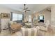 Open and airy living room with hardwood floors and ample natural light at 21341 Edgewater Dr, Port Charlotte, FL 33952