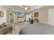 Bright and airy main bedroom with wood-look floors, and access to the bathroom at 21341 Edgewater Dr, Port Charlotte, FL 33952