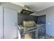 Modern outdoor kitchen with stainless steel grill and granite countertop at 21341 Edgewater Dr, Port Charlotte, FL 33952