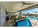 Lush patio with pool, seating area and water views at 21341 Edgewater Dr, Port Charlotte, FL 33952