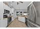 Kitchen with stainless steel appliances and white cabinets at 2246 Jasmine Way, North Port, FL 34287