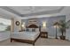 Spacious main bedroom with a king-size bed and private access to the backyard at 2246 Jasmine Way, North Port, FL 34287