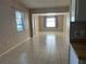 Spacious living room with tile floors and a view to the kitchen at 2273 Ednor St, Port Charlotte, FL 33952