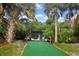 Private boat ramp with lush, tropical landscaping at 24092 Potosi Ct, Punta Gorda, FL 33955