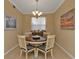 Charming dining area with a round table and four chairs at 3500 Mondovi Ct # 311, Punta Gorda, FL 33950