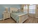 Inviting main bedroom with white furniture and coastal-themed decor at 3500 Mondovi Ct # 311, Punta Gorda, FL 33950