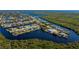 Serene aerial shot of a waterfront neighborhood surrounded by tranquil canals and waterways at 4203 Surfside Ct, Port Charlotte, FL 33948