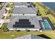 Aerial view of house, highlighting solar panels and pool at 43015 Parkside Ct, Punta Gorda, FL 33982