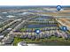 Aerial view of community with various amenities and nearby houses at 43015 Parkside Ct, Punta Gorda, FL 33982
