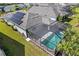 Aerial view showcasing the home's pool and solar panels at 43015 Parkside Ct, Punta Gorda, FL 33982