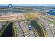 Aerial view of community near lake and shops at 43015 Parkside Ct, Punta Gorda, FL 33982