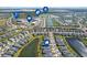 Aerial view of community, showcasing homes, lakes, and nearby amenities at 43015 Parkside Ct, Punta Gorda, FL 33982