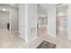 Bright hallway with tile flooring and access to bathroom and living areas at 43015 Parkside Ct, Punta Gorda, FL 33982