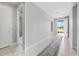 Bright and spacious hallway with tile flooring and access to other rooms at 43015 Parkside Ct, Punta Gorda, FL 33982