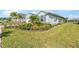 Well-maintained house exterior with lush landscaping at 43015 Parkside Ct, Punta Gorda, FL 33982