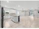 Open concept kitchen with island and stainless steel appliances at 43015 Parkside Ct, Punta Gorda, FL 33982