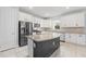 Modern kitchen with granite countertops and white cabinets at 43015 Parkside Ct, Punta Gorda, FL 33982