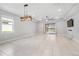 Spacious living area with tile floors and sliding glass doors at 43015 Parkside Ct, Punta Gorda, FL 33982