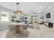 Open-concept living space with dining area and access to the back patio at 43015 Parkside Ct, Punta Gorda, FL 33982