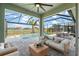 Relaxing screened-in pool area with patio furniture at 43015 Parkside Ct, Punta Gorda, FL 33982
