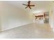 Open living room with kitchen and tile floors at 5127 Melbourne St # F302, Punta Gorda, FL 33980