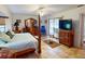 Spacious Primary bedroom with a large bed and ensuite bathroom access at 116 Colonial Sw St, Port Charlotte, FL 33952
