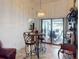 Bright breakfast nook with table and chairs, near sliding doors leading to the pool at 116 Colonial Sw St, Port Charlotte, FL 33952