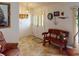 Inviting entryway with a charming wooden bench and stained-glass door at 116 Colonial Sw St, Port Charlotte, FL 33952