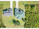 Aerial view of two houses and surrounding landscape at 12333 Willmington Blvd, Port Charlotte, FL 33981