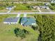 Two homes situated side-by-side on a grassy lot at 12333 Willmington Blvd, Port Charlotte, FL 33981