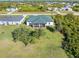 Aerial view of home with covered patio and large yard at 12333 Willmington Blvd, Port Charlotte, FL 33981