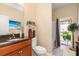 Bathroom features a walk-in shower, toilet, and granite countertop at 12333 Willmington Blvd, Port Charlotte, FL 33981