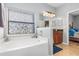 Relaxing bathroom with a garden tub and double sink vanity at 12333 Willmington Blvd, Port Charlotte, FL 33981