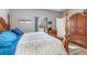 Spacious bedroom with a king-size bed and wooden furniture at 12333 Willmington Blvd, Port Charlotte, FL 33981