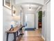 Bright and airy entryway with tiled floors and a wooden console table at 12333 Willmington Blvd, Port Charlotte, FL 33981