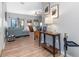 Bright and spacious entryway with wood-look floors and views to the living room at 12333 Willmington Blvd, Port Charlotte, FL 33981