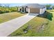 Single-story home with attached garage and large driveway at 12333 Willmington Blvd, Port Charlotte, FL 33981