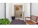 Inviting front entrance with a fall wreath and a welcoming bench at 12333 Willmington Blvd, Port Charlotte, FL 33981
