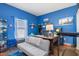 Bright home office features built-in desk, comfortable couch, and ample storage at 12333 Willmington Blvd, Port Charlotte, FL 33981
