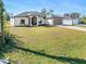 Single-story home with attached garage and well-manicured lawn at 12333 Willmington Blvd, Port Charlotte, FL 33981