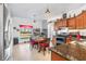 Bright kitchen featuring wood cabinets, granite counters, and a dining area at 12333 Willmington Blvd, Port Charlotte, FL 33981