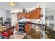 Spacious kitchen with granite countertops, stainless steel appliances, and wood cabinets at 12333 Willmington Blvd, Port Charlotte, FL 33981