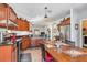 Bright kitchen features stainless steel appliances and dark wood cabinets at 12333 Willmington Blvd, Port Charlotte, FL 33981