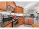 Modern kitchen with stainless steel appliances and dark countertops at 12333 Willmington Blvd, Port Charlotte, FL 33981