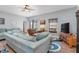 Relaxing living room featuring comfy sofas and a ceiling fan at 12333 Willmington Blvd, Port Charlotte, FL 33981