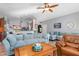 Open living area with a partial view of the kitchen and a ceiling fan at 12333 Willmington Blvd, Port Charlotte, FL 33981