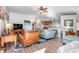 Open living area with a comfortable seating arrangement and wood-look floors at 12333 Willmington Blvd, Port Charlotte, FL 33981